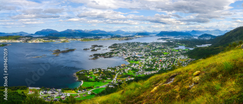 landscape with fjord and mountains, over coastal village in Norway