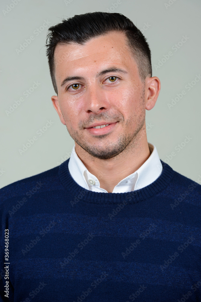 Fototapeta premium Portrait of happy young handsome man smiling