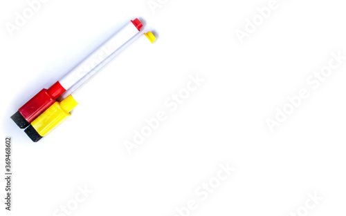 Red and yellow marker isolated items on white background photo