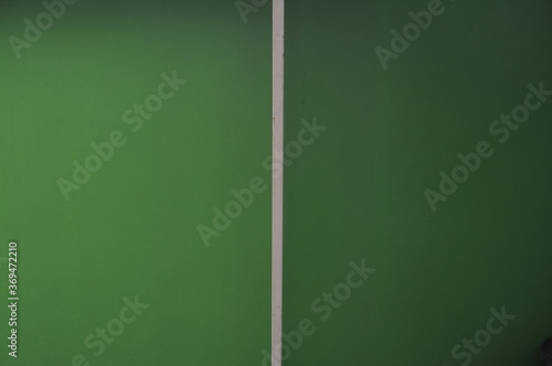 green chalkboard background.The background is made of patterned green concrete.