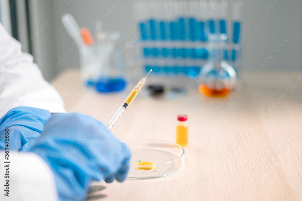 Professional doctors perform testing and analyzing samples of vaccines for immunization prevention and treatment from viral infections. Medical and health care concepts Professional doctors perform testing and analyzing samples of vaccines for immunization prevention and treatment from viral infections. Medical and health care concepts