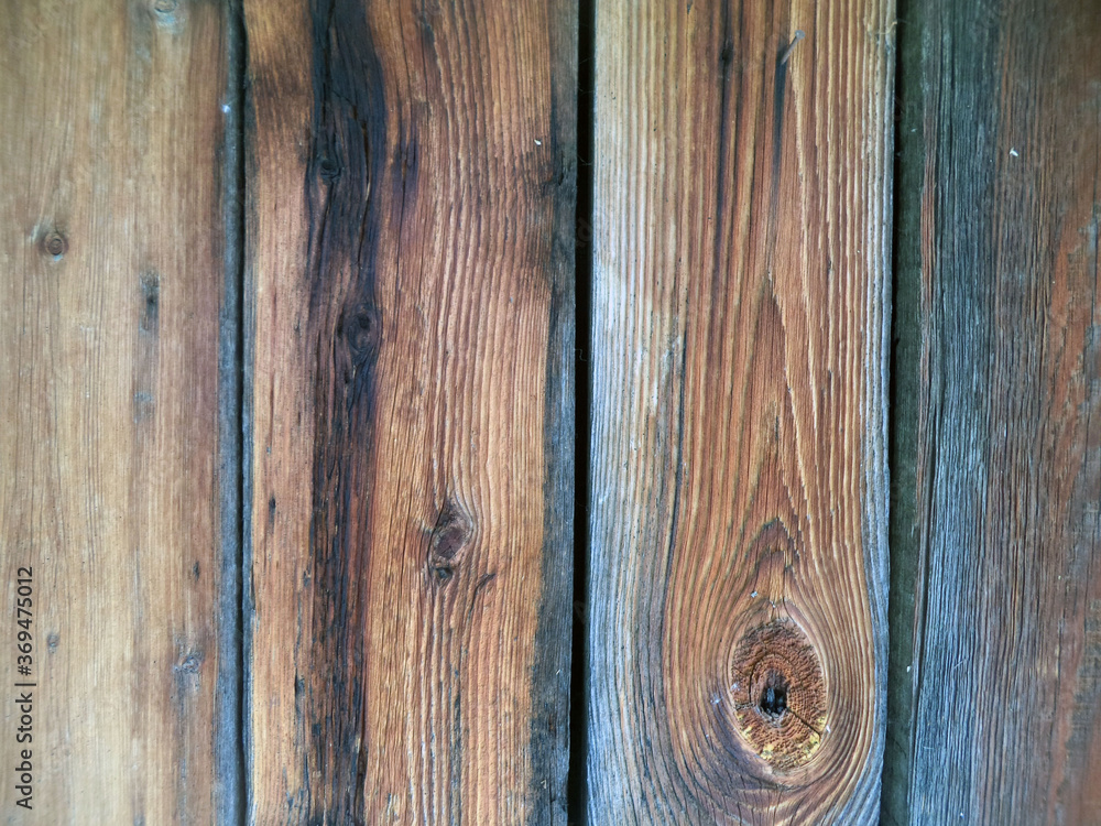 Obraz premium The dark background of vertical planks. Background for websites. Wooden structure, pattern