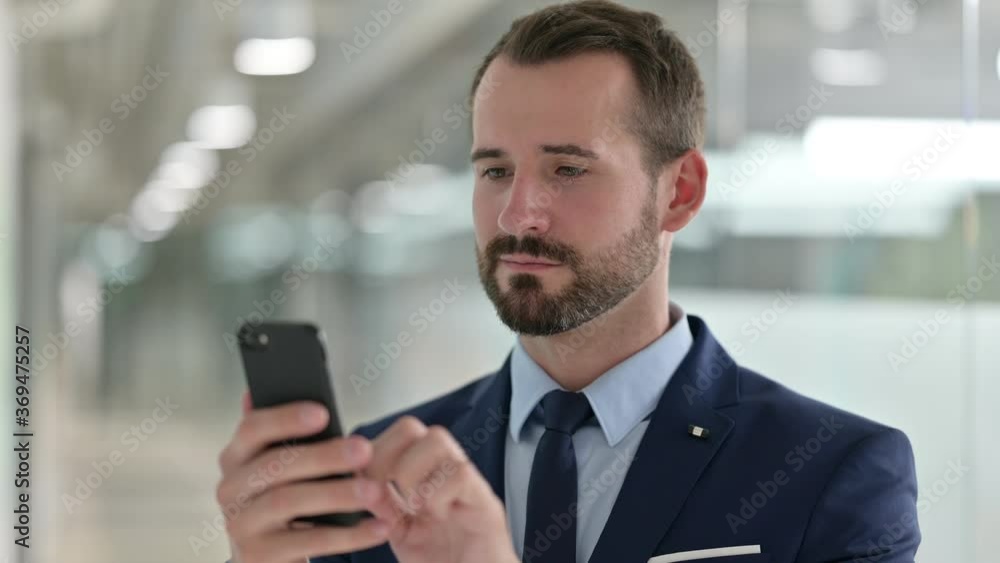 Portrait of Businessman using Smartphone Portrait of Businessman using Smartphone