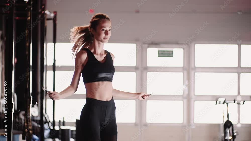 Slim Female Athlete Training At Fitness Club Slim Female Athlete Training At Fitness Club