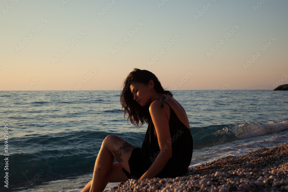 Girl enjoying the sunset on the beach Girl enjoying the sunset on the beach
