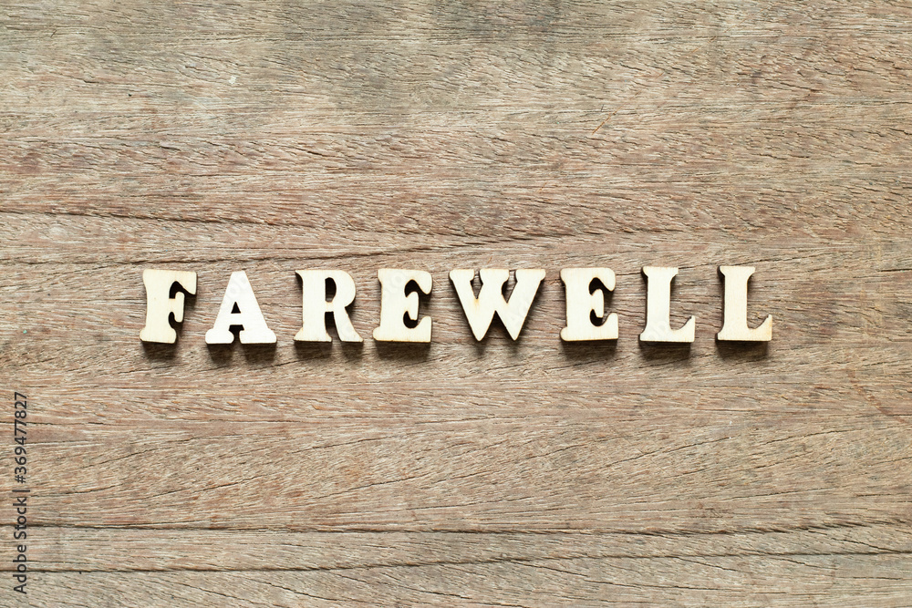 Alphabet letter block in word farewell on wood background Alphabet letter block in word farewell on wood background