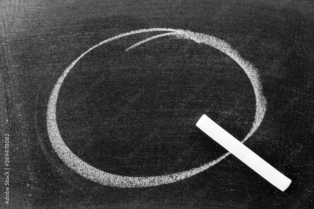 White color chalk hand drawing in circle or round shape and chalk on blackboard background with copy space or empty area for decoration