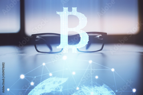 Crypto theme hologram with glasses on the table background. Concept of blockchain. Double exposure.