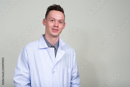 Portrait of happy young man doctor smiling © Ranta Images