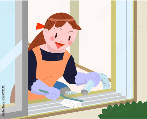 窓サッシを清掃する女性