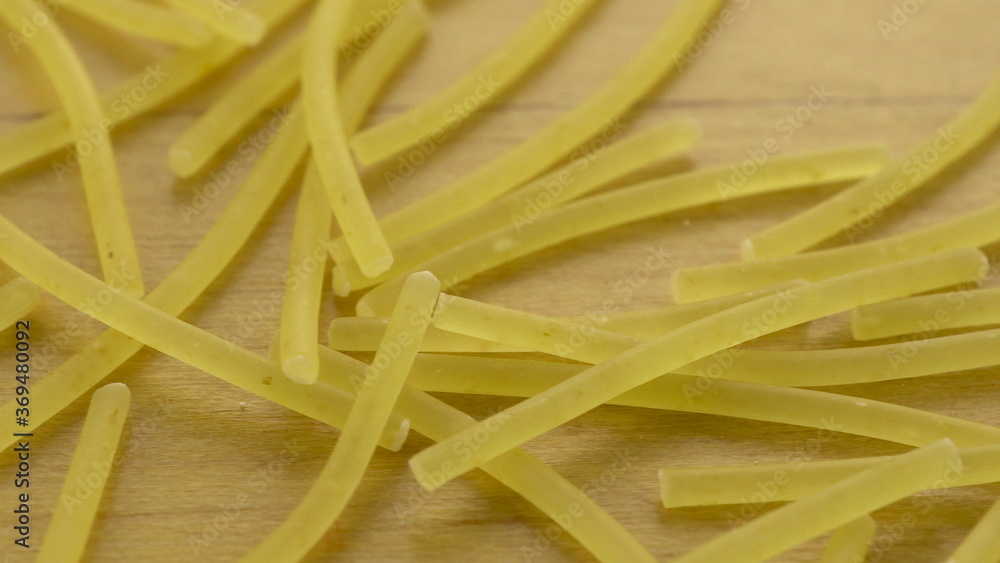 Noodles lie on a wooden surface. Pasta macro shot. Noodles lie on a wooden surface. Pasta macro shot.