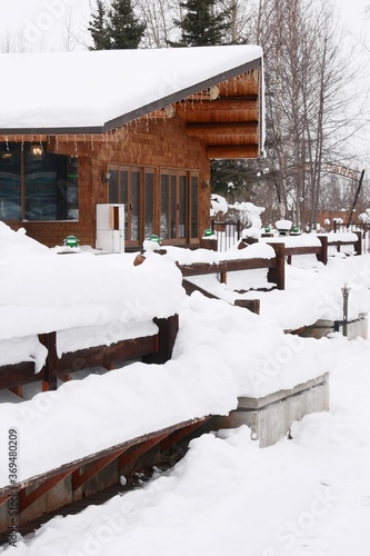 Wallpaper Mural  Log cabins covered with fresh snow in Pike’s Waterfront Lodge Torontodigital.ca