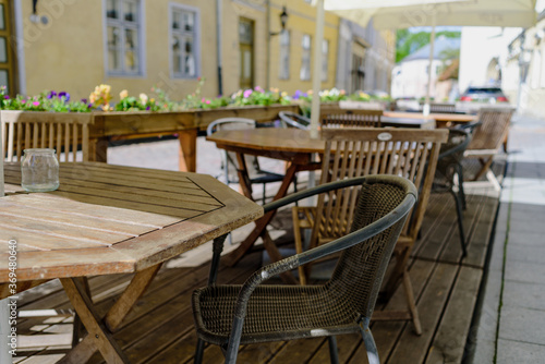 Empty tables in street summer terrace cafe © molenira