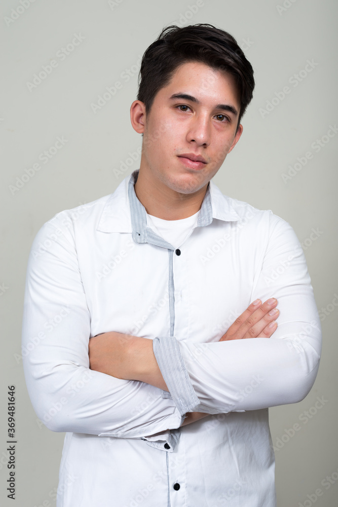 Portrait of young handsome businessman with arms crossed Portrait of young handsome businessman with arms crossed