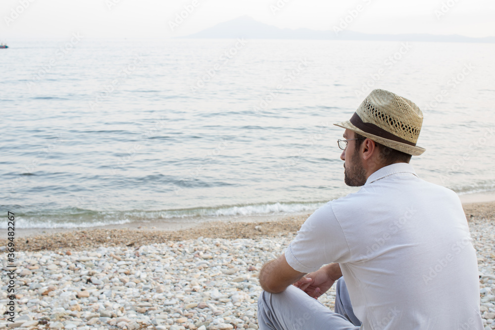 Pensive man at the beach
