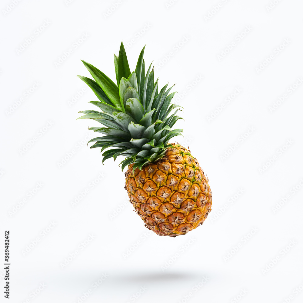 Flying in air pineapple tropical fruit. Healthy vitamin
