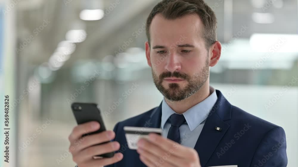 Portrait of Businessman having Online Payment Failure on Smartphone Portrait of Businessman having Online Payment Failure on Smartphone