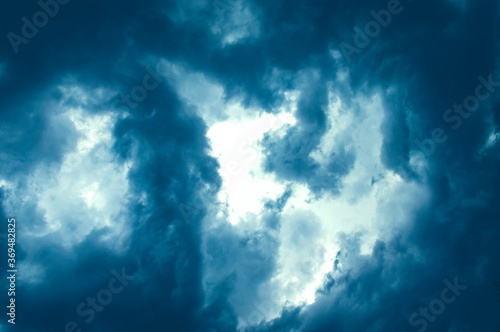 Blue contrasting clouds in the sky. View from the plane