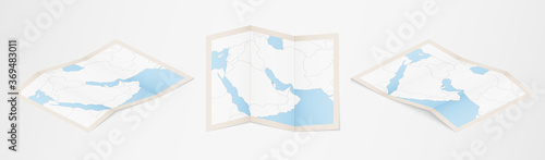 Folded map of Bahrain in three different versions.