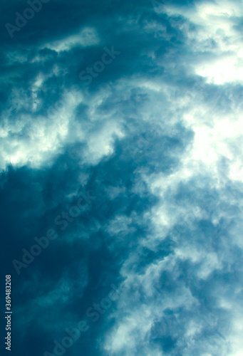 Blue contrasting clouds in the sky. View from the plane