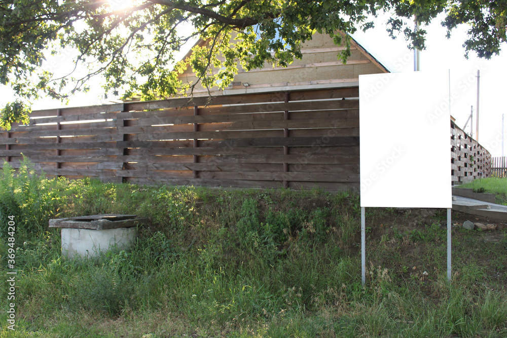 mock up stand signboard in the countryside dacha village near the wooden house mock up stand signboard in the countryside dacha village near the wooden house