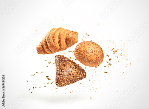 Bild auf Leinwand Croissant bun brioche cake flying in air