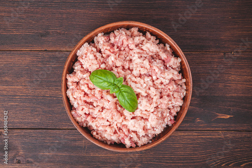 Photography Raw minced meat in bowl on wooden table