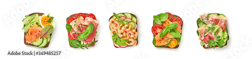 Open sandwiches with vegetables, avocado, tomato, mozzarella, egg and soft cheese. Homemade sandwich collection with salmon, ham, cucumber, radish, herbs isolated on white, top view