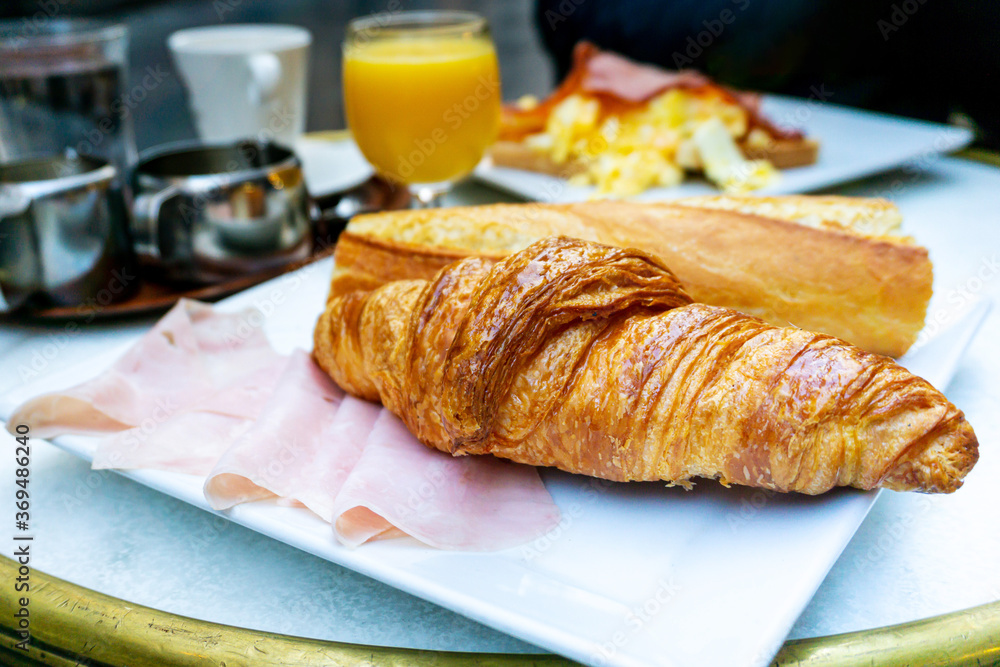 Breakfast with coffee and croissants on table Breakfast with coffee and croissants on table