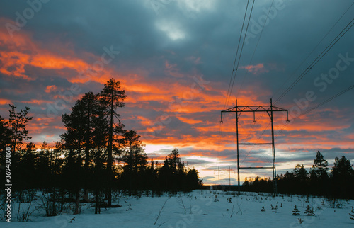 Transporting electricity. Colorful sky during sunset.