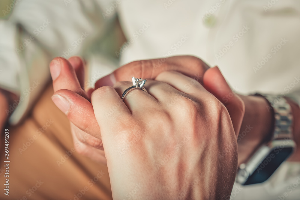 Fototapeta premium hands of groom and bride
