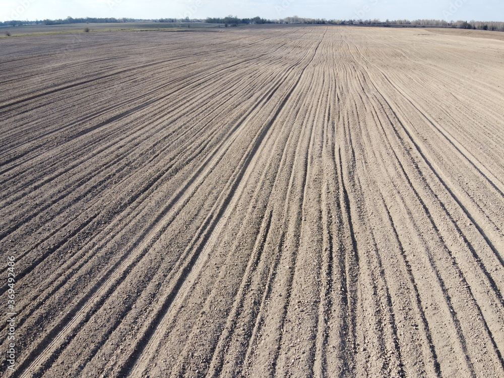Plowed agricultural field, aerial view. Agricultural land.