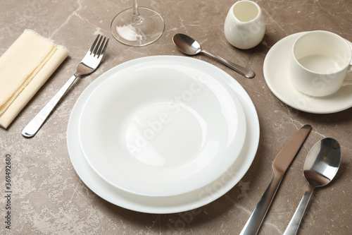 Composition of table setting with cutlery on gray background