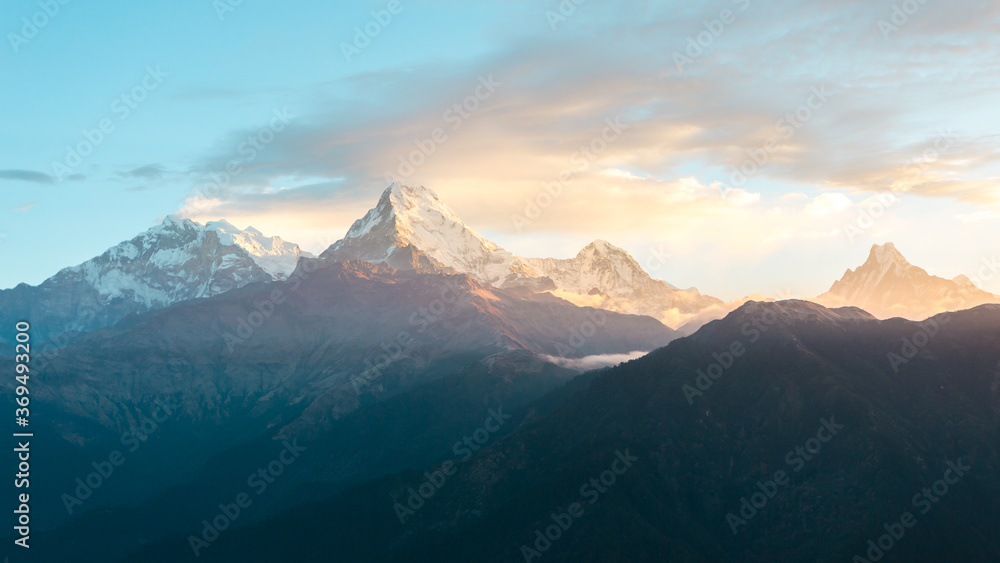 Himalaya mountains range on sunrise. Mighty misty snowy Himalayas, mountain background.