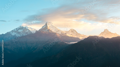 Himalaya mountains range on sunrise. Mighty misty snowy Himalayas, mountain background.