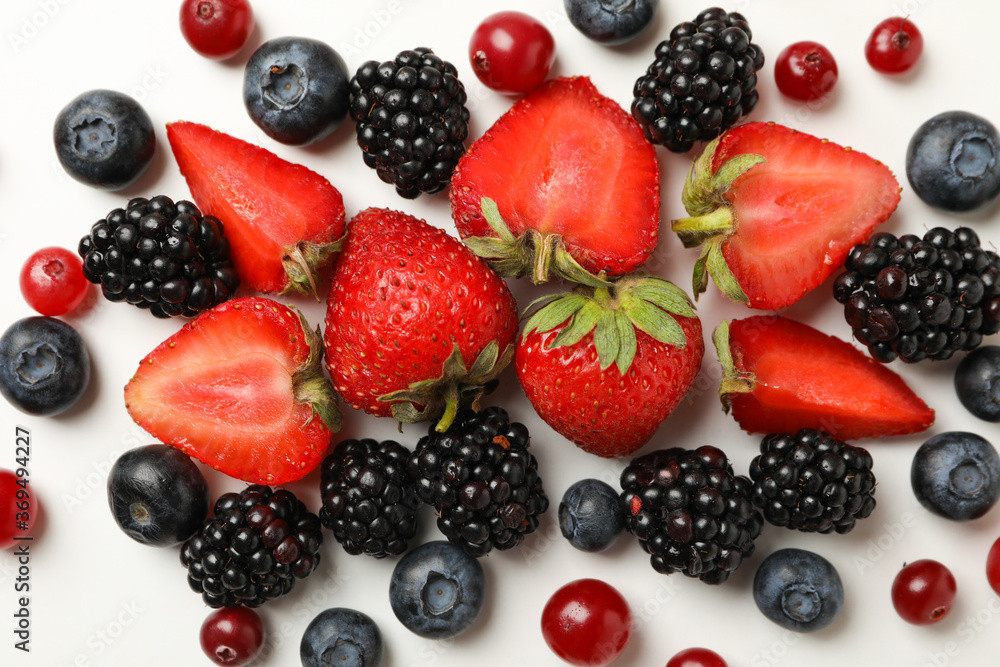 Mix of fresh berries on white background, top view