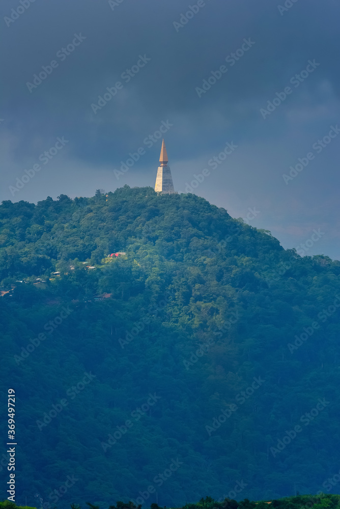 Golden Pagoda located on the top of a mountain with dramatic sky at phu thap boek, Phetchabun, Thailand.