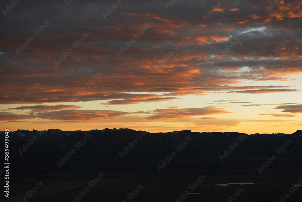Dramatic sky cluds. Orange lenticular cluds. Sunset. South Patagonian sky. Dramatic sky cluds. Orange lenticular cluds. Sunset. South Patagonian sky.