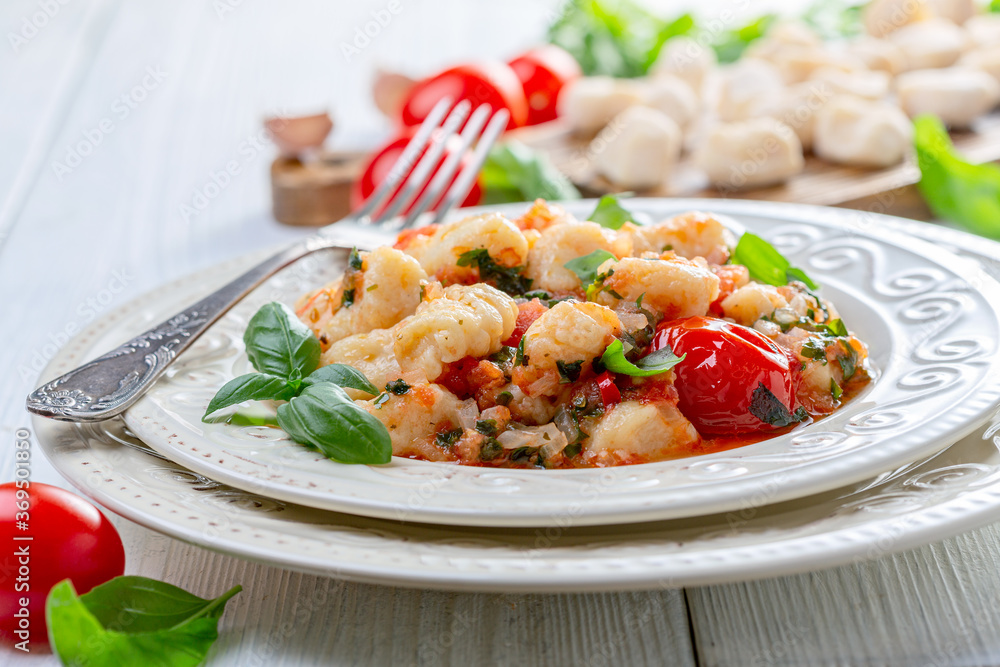 Traditional potato gnocchi with tomato sauce. Traditional potato gnocchi with tomato sauce.