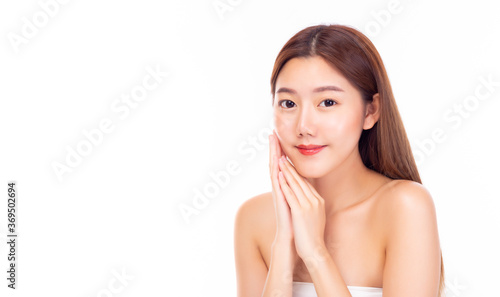 Happy beautiful asian woman showing her beauty face with smile. Attractive young asia female apply natural makeup. Pretty girl has nice facial skin. Cosmetology, beauty and Spa concept. copy space