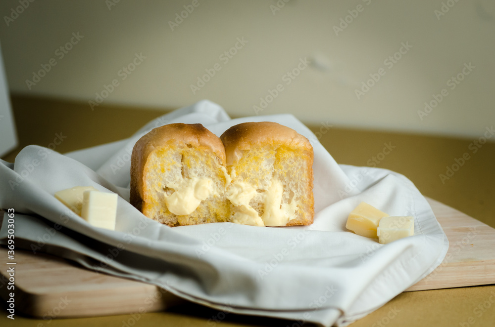 Cheese Bread on a wooden cutting board fabric Cheese Bread on a wooden cutting board fabric