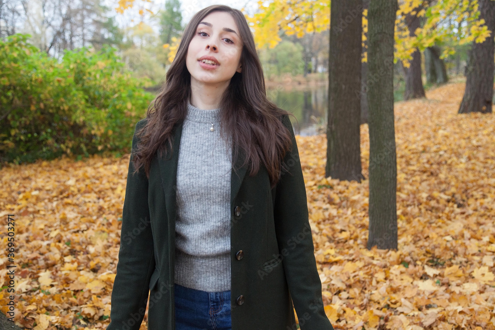 Portrait of walking young girl in autumn park Portrait of walking young girl in autumn park