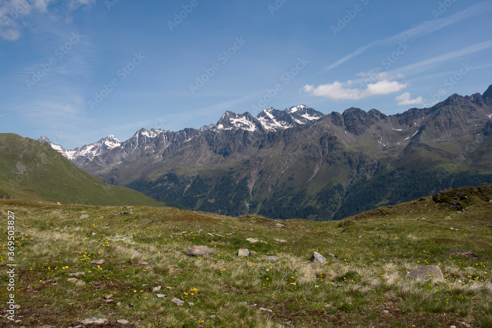 Fototapeta premium Typical landscape of Austria, summer background. Background with fields, mountains and blue skies