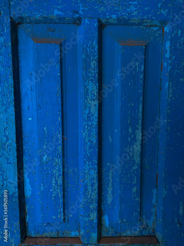 Handmade blue old wood decoration. Wooden door texture background.