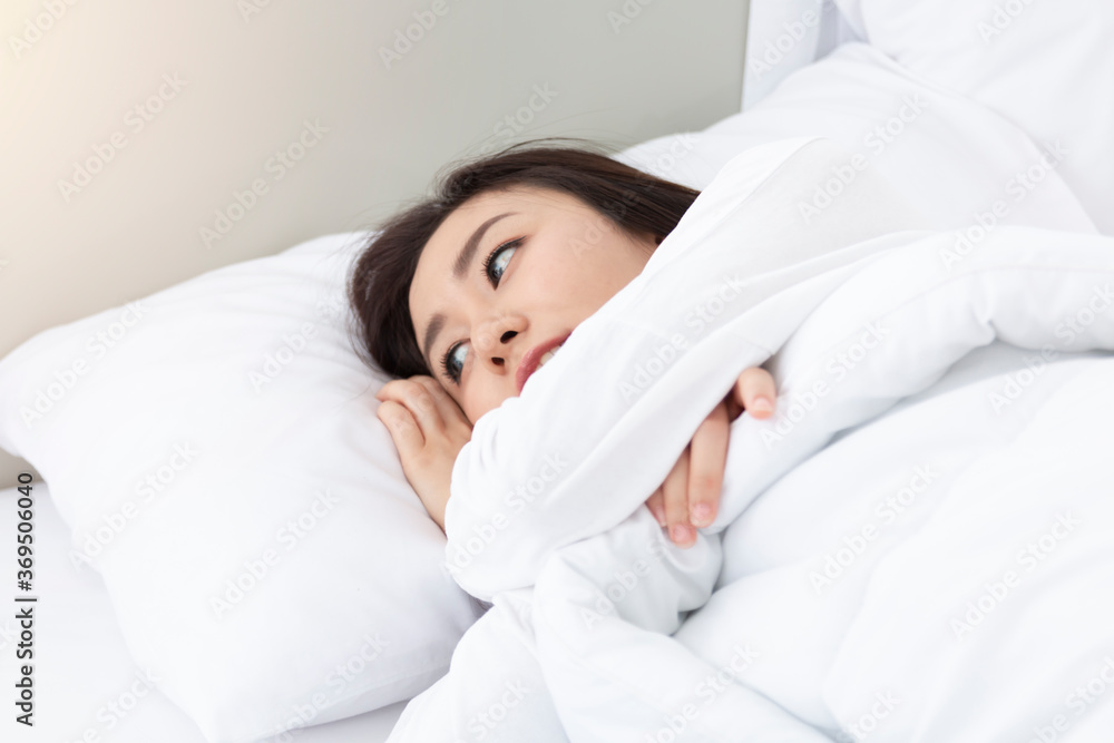 Young Woman Sleeping In Bed. Portrait Of Beautiful Female Resting On Comfortable Bed With Pillows in the morning. Happy woman sleeping on a pillow in bed and smiling. Pretty young girl on white bed. Young Woman Sleeping In Bed. Portrait Of Beautiful Female Resting On Comfortable Bed With Pillows in the morning. Happy woman sleeping on a pillow in bed and smiling. Pretty young girl on white bed.