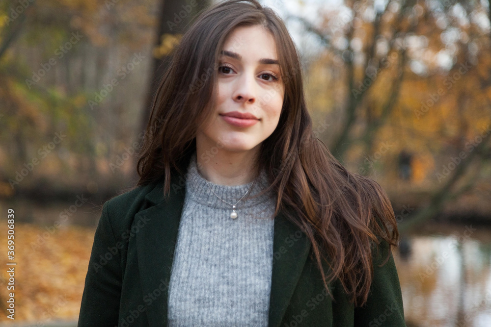 Portrait of girl in autumn park