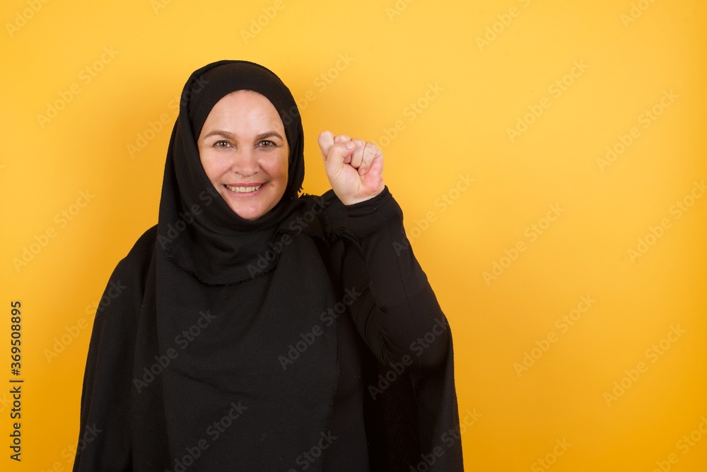 Young handsome Cucasian businessman wearing red shirt standing against yellow background pointing up with fingers number ten in Chinese sign language Shi Young handsome Cucasian businessman wearing red shirt standing against yellow background pointing up with fingers number ten in Chinese sign language Shi