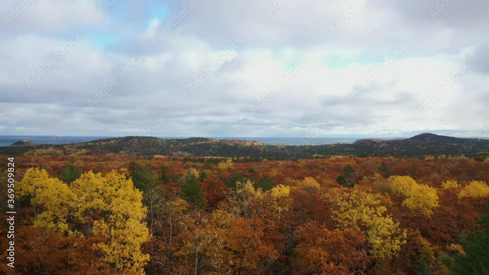 Mountain bikers in the fall near Lake Superior in Northern Michigan Mountain bikers in the fall near Lake Superior in Northern Michigan