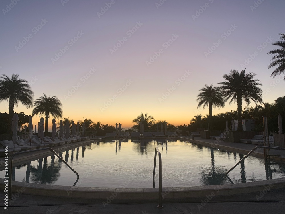 Fototapeta premium Reflective pool under a dusky sunset
