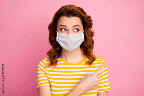 Close-up portrait of her she nice attractive wavy-haired healthy girl wearing safety mask demonstrating copy space info mers cov therapy symptom syndrome disease isolated pink pastel color background